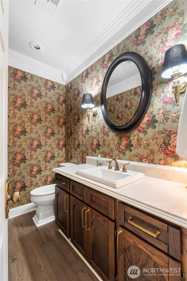 4217 Lakeridge Dr E, Lake Tapps, WA 98391 - bathroom with wood finished floors, baseboards, vanity, toilet, and ornamental molding
