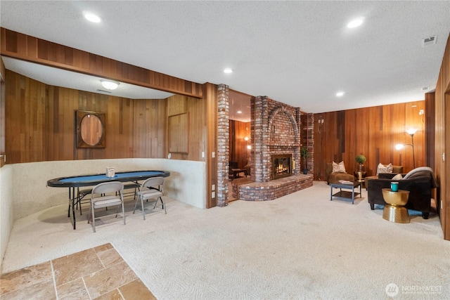 4217 Lakeridge Dr E, Lake Tapps, WA 98391 - living area with wood walls, a brick fireplace, recessed lighting, carpet floors, and a textured ceiling