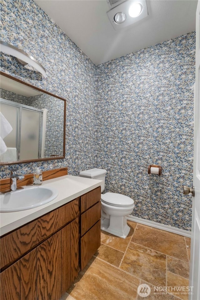 4217 Lakeridge Dr E, Lake Tapps, WA 98391 - bathroom featuring wallpapered walls, a shower stall, toilet, and vanity