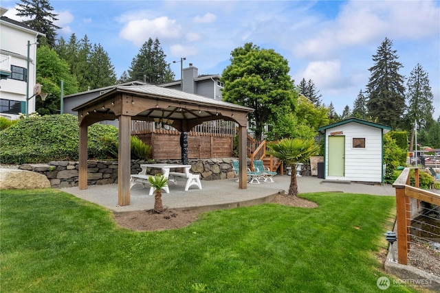 4217 Lakeridge Dr E, Lake Tapps, WA 98391 - view of grassy yard featuring a patio, a gazebo, a storage shed, and an outbuilding