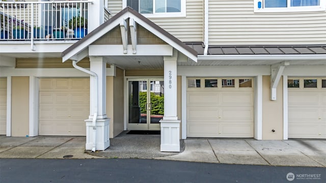 doorway to property with an attached garage