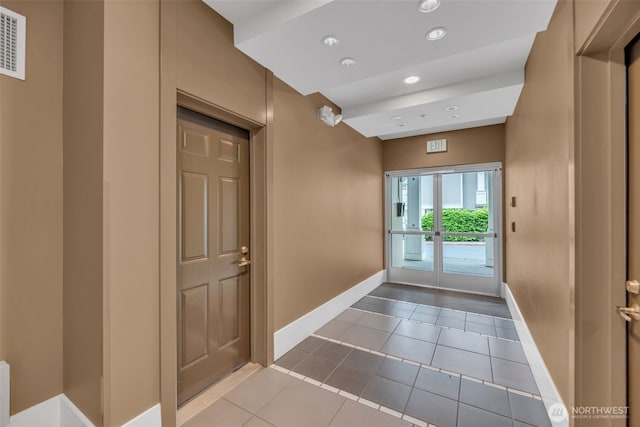 entrance foyer with baseboards, tile patterned flooring, and recessed lighting