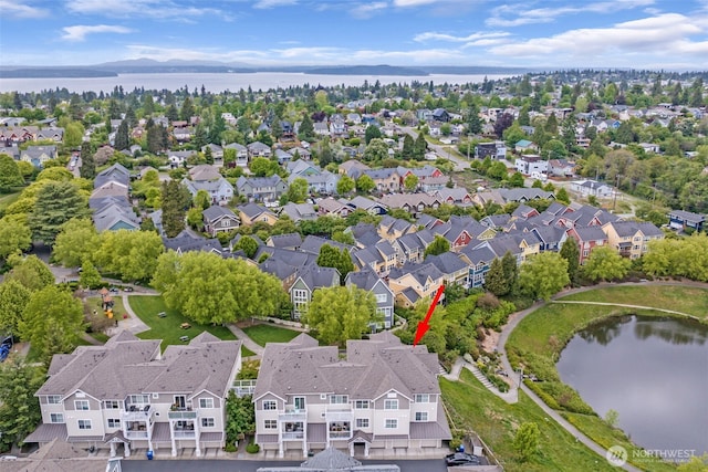 aerial perspective of suburban area with a nearby body of water