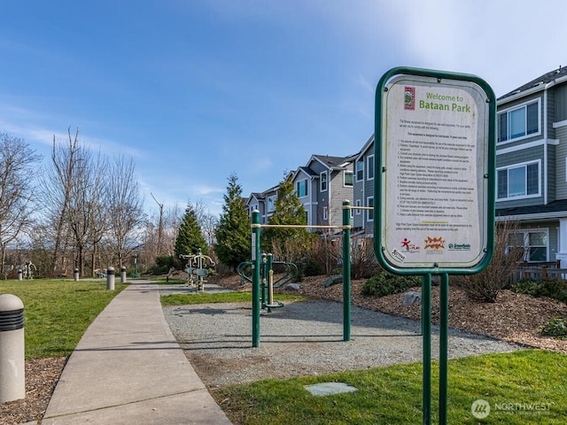 view of home's community with a yard