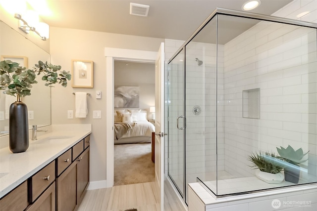 16001 1st Ave NE, Duvall, WA 98019 - ensuite bathroom with a shower stall, double vanity, recessed lighting, and baseboards