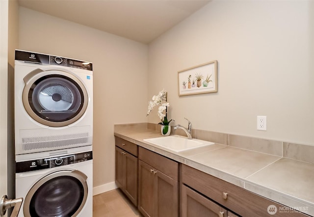 16001 1st Ave NE, Duvall, WA 98019 - washroom with stacked washer / dryer, baseboards, and cabinet space