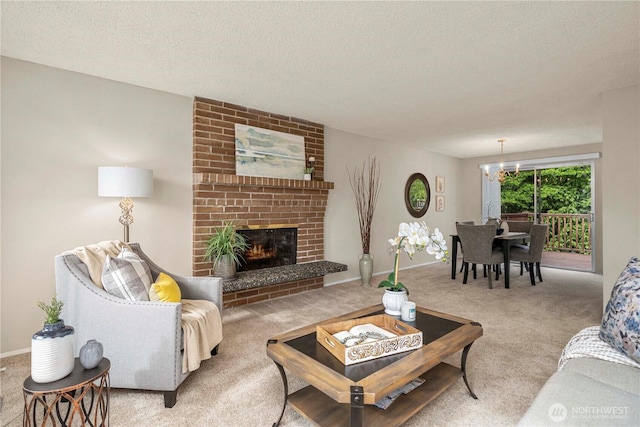 living area with carpet floors, a chandelier, a textured ceiling, a brick fireplace, and baseboards