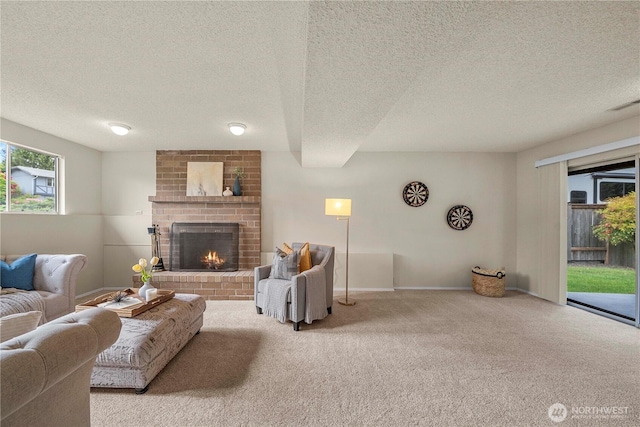 carpeted living area featuring a textured ceiling, a brick fireplace, and baseboards