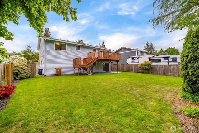 rear view of property featuring stairs and a wooden deck