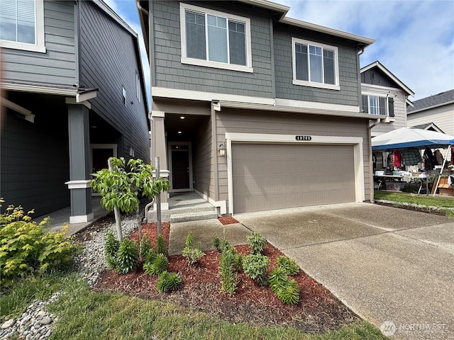 18708 108th Ave SE, Puyallup, WA 98374 - view of front of house with a garage and concrete driveway