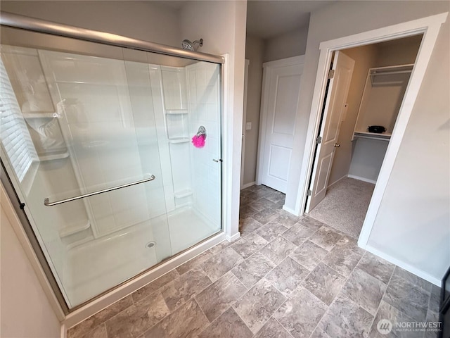 18708 108th Ave SE, Puyallup, WA 98374 - full bathroom with a shower stall, stone finish flooring, baseboards, and a closet