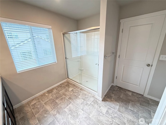 18708 108th Ave SE, Puyallup, WA 98374 - full bathroom featuring baseboards, a stall shower, and stone finish floors