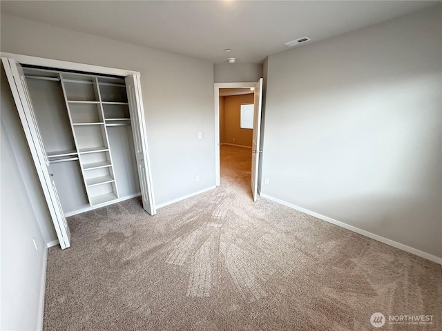 18708 108th Ave SE, Puyallup, WA 98374 - unfurnished bedroom featuring carpet flooring, a closet, and baseboards