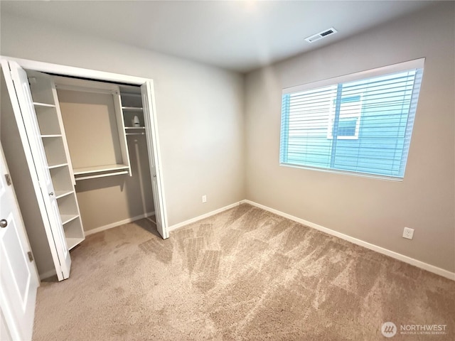 18708 108th Ave SE, Puyallup, WA 98374 - unfurnished bedroom featuring carpet, baseboards, and a closet