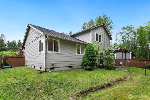 rear view of property with roof with shingles