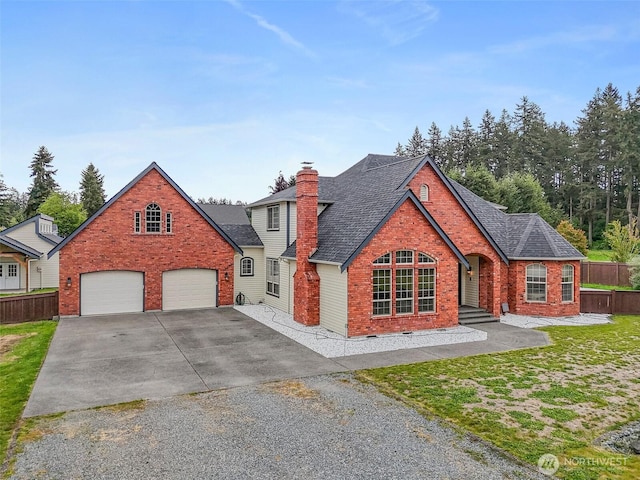 16915 32nd Ave E, Tacoma, WA 98446 - view of front of property featuring brick siding, concrete driveway, fence, a garage, and a chimney