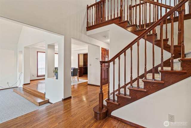 16915 32nd Ave E, Tacoma, WA 98446 - staircase featuring wood finished floors and a towering ceiling