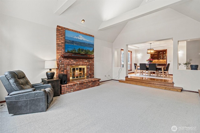 16915 32nd Ave E, Tacoma, WA 98446 - living room with high vaulted ceiling, carpet floors, beamed ceiling, a fireplace, and baseboards