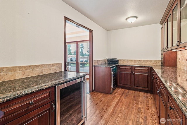 16915 32nd Ave E, Tacoma, WA 98446 - kitchen with beverage cooler, light wood-style floors, glass insert cabinets, and backsplash