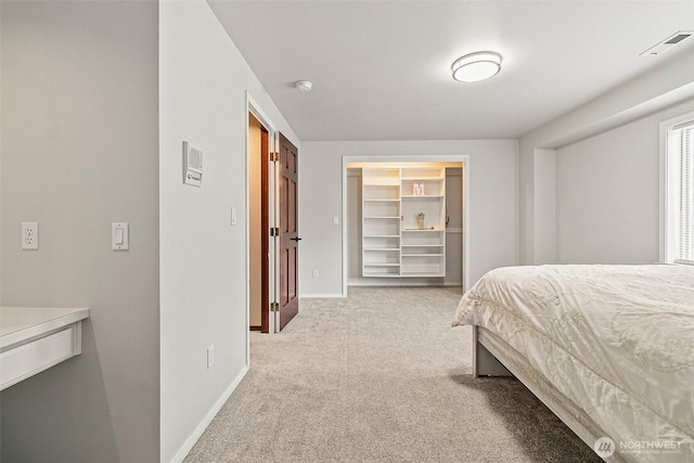 16915 32nd Ave E, Tacoma, WA 98446 - bedroom featuring light colored carpet, baseboards, and a spacious closet