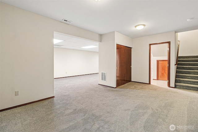 16915 32nd Ave E, Tacoma, WA 98446 - carpeted spare room featuring stairs, baseboards, and a smoke detector