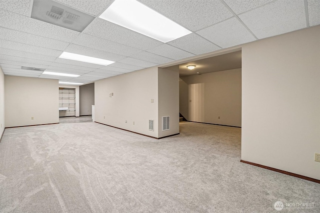 16915 32nd Ave E, Tacoma, WA 98446 - carpeted empty room featuring a paneled ceiling, baseboards, and stairs