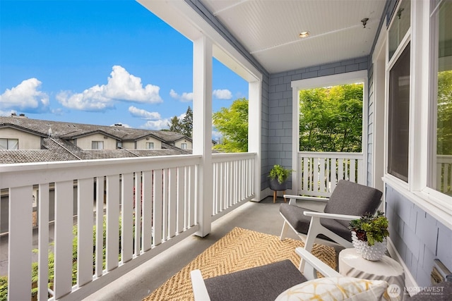 120 Hall Brothers Loop NW Unit 103, Bainbridge Island, WA 98110 - covered porch featuring a residential view
