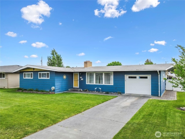 1102 E Elm St, Othello, WA 99344 - single story home featuring an attached garage, a chimney, a front lawn, and concrete driveway