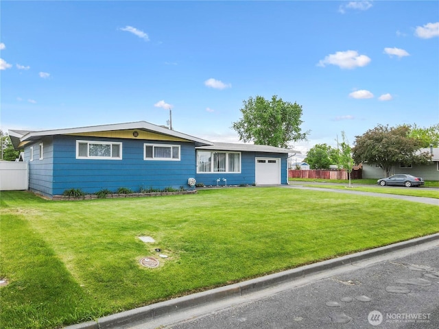 1102 E Elm St, Othello, WA 99344 - single story home featuring an attached garage and driveway