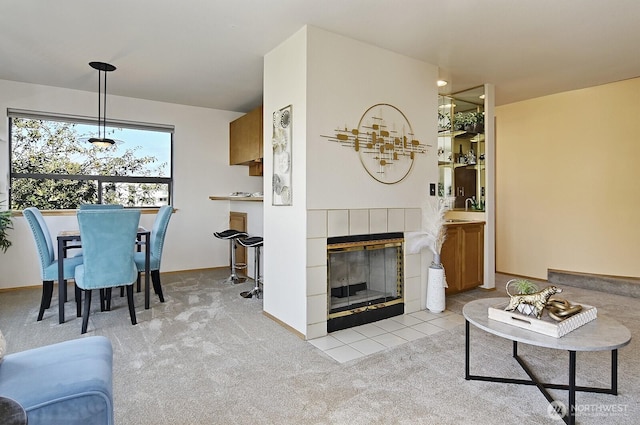1604 11th Ave S Unit 402, Seattle, WA 98134 - living room featuring a fireplace and light carpet