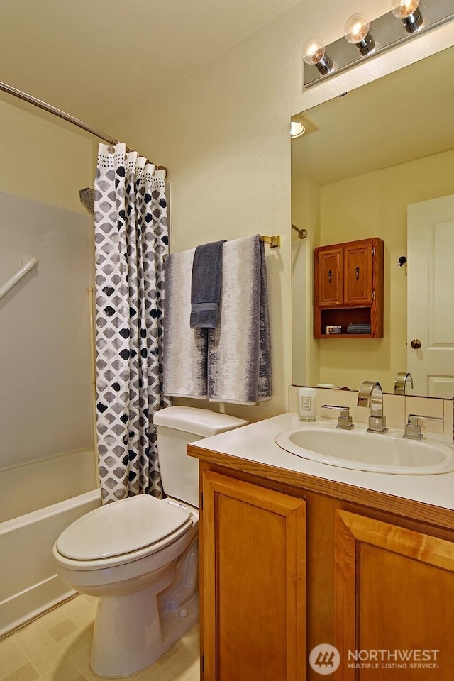 1604 11th Ave S Unit 402, Seattle, WA 98134 - bathroom featuring toilet, shower / bath combo with shower curtain, and vanity