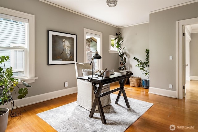 office with ornamental molding, wood finished floors, and baseboards
