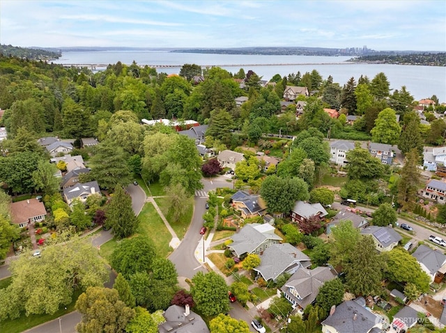 aerial perspective of suburban area featuring a nearby body of water