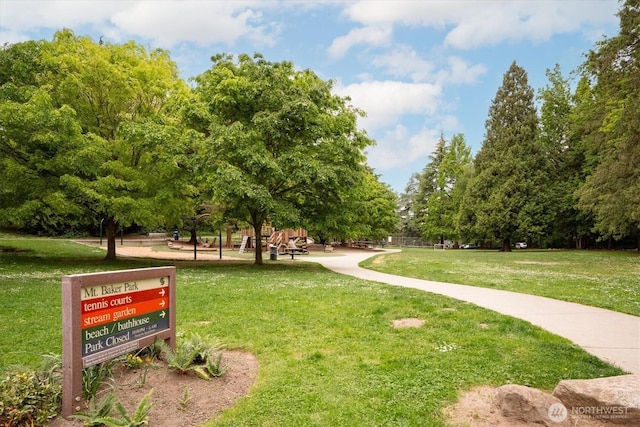 view of property's community with a yard
