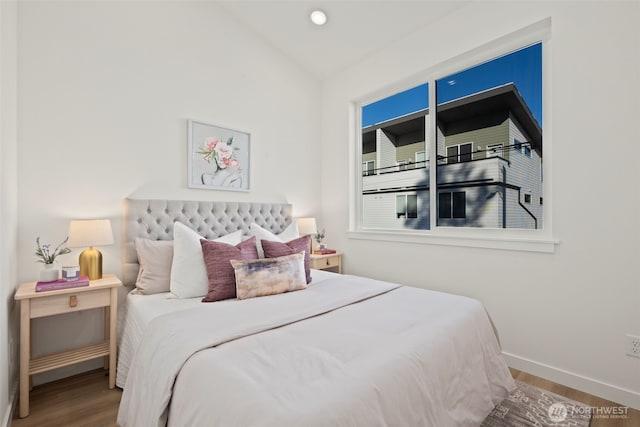 1050C S Donovan St, Seattle, WA 98108 - bedroom featuring wood finished floors, baseboards, and vaulted ceiling