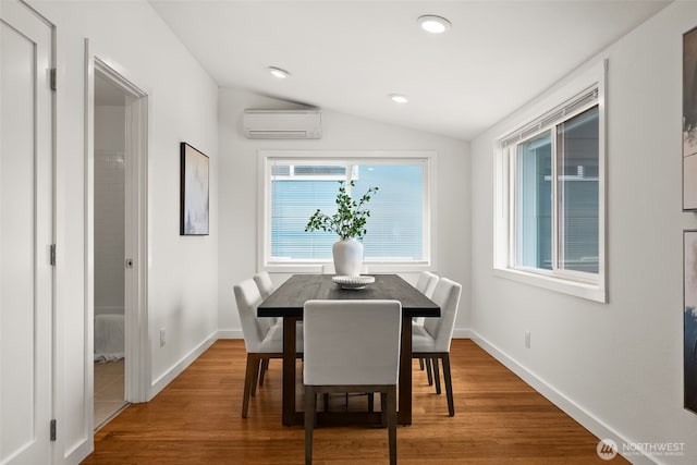 5903 19th Ave S, Seattle, WA 98108 - dining space featuring a wall unit AC, lofted ceiling, wood finished floors, and recessed lighting
