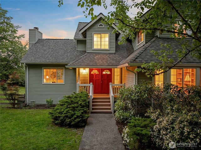 8484 NE County Park Rd, Bainbridge Island, WA 98110 - view of front of home featuring roof with shingles, a chimney, and a front yard