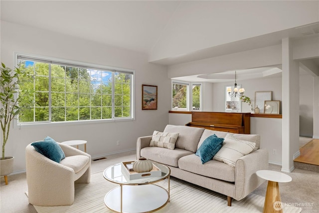 8484 NE County Park Rd, Bainbridge Island, WA 98110 - living room featuring baseboards, a chandelier, light colored carpet, and vaulted ceiling