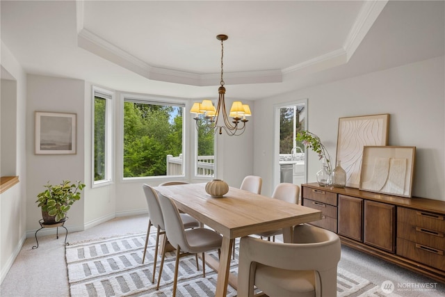 8484 NE County Park Rd, Bainbridge Island, WA 98110 - dining area with a tray ceiling, a chandelier, light carpet, ornamental molding, and baseboards