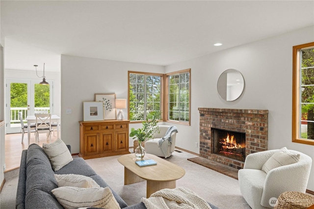 8484 NE County Park Rd, Bainbridge Island, WA 98110 - living room with a fireplace, light colored carpet, and recessed lighting