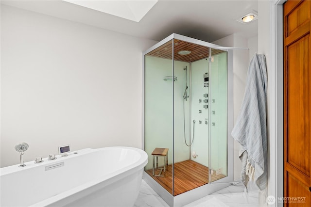 8484 NE County Park Rd, Bainbridge Island, WA 98110 - full bath with marble finish floors, a skylight, a freestanding tub, and a shower stall