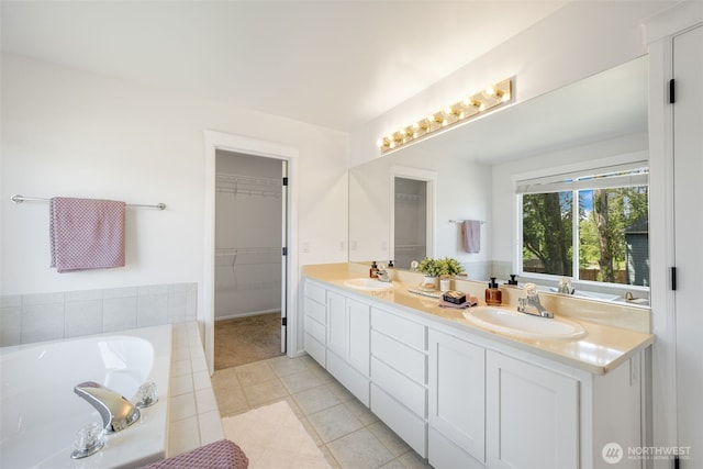 20347 86th Pl NE, Bothell, WA 98011 - full bath with double vanity, tile patterned floors, a garden tub, and a walk in closet