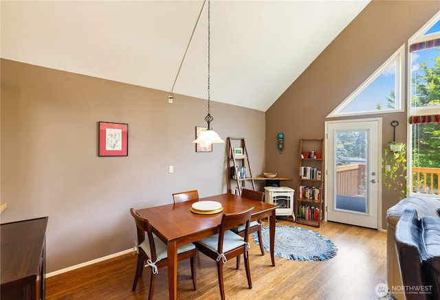 495 Colville Ln, Conner, WA 98257 - dining room with wood finished floors, vaulted ceiling, and baseboards