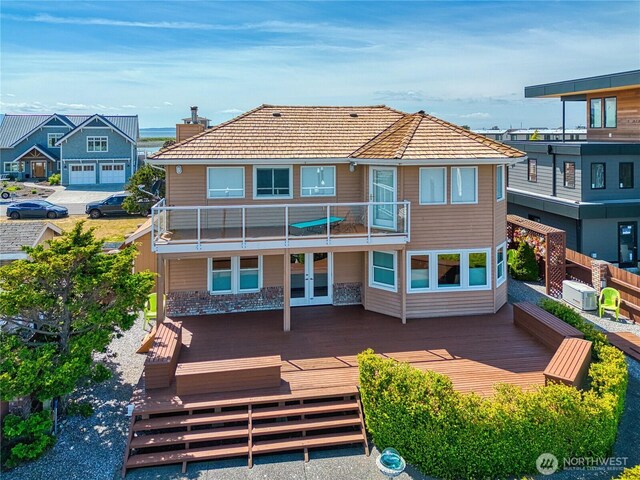 4020 Mayne Ln, Ferndale, WA 98248 - rear view of house with french doors, a tiled roof, and a balcony