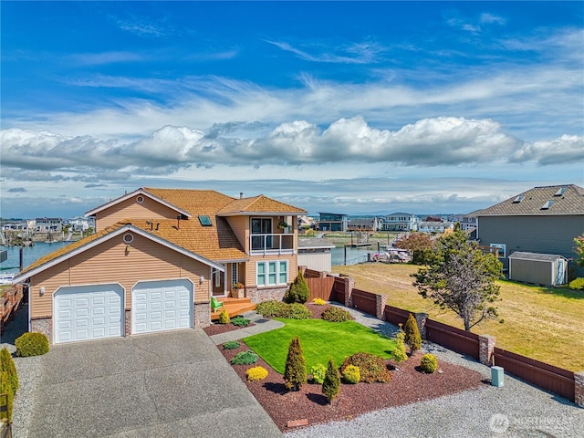 4020 Mayne Ln, Ferndale, WA 98248 - traditional home with driveway, a garage, a balcony, and stone siding