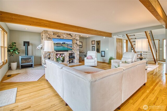4020 Mayne Ln, Ferndale, WA 98248 - living area with beamed ceiling, stairs, light wood-type flooring, a wood stove, and recessed lighting