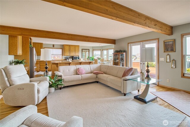 4020 Mayne Ln, Ferndale, WA 98248 - living area with light wood finished floors, beam ceiling, and baseboards