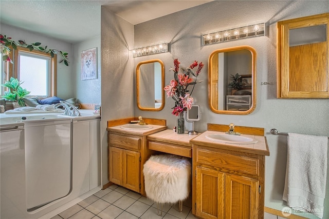 4020 Mayne Ln, Ferndale, WA 98248 - full bathroom with tile patterned floors, a textured wall, two vanities, and a textured ceiling