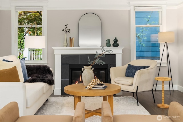 421 16th Ave E, Seattle, WA 98112 - living room with a tile fireplace, wood finished floors, healthy amount of natural light, crown molding, and baseboards