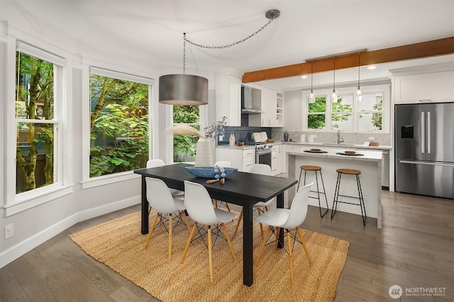 421 16th Ave E, Seattle, WA 98112 - dining area featuring baseboards and wood finished floors